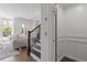 Living room with hardwood floors, modern decor, staircase, and elevator access at 312 Concord St, Alpharetta, GA 30009
