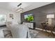 Comfortable living room with neutral decor, featuring a stylish media console and accent wall at 312 Concord St, Alpharetta, GA 30009