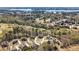 Beautiful aerial of homes nestled among trees, offering a serene view of the lake and surrounding community at 7090 Blue Sky Drive, Locust Grove, GA 30248