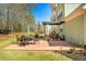 Relax on the home's comfortable back patio, perfect for entertaining or enjoying the backyard view at 7090 Blue Sky Drive, Locust Grove, GA 30248