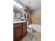 Cozy bathroom with a shower-tub combo, vanity and tiled floors at 7090 Blue Sky Drive, Locust Grove, GA 30248
