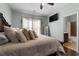 Spacious bedroom with a ceiling fan and ensuite bath at 7090 Blue Sky Drive, Locust Grove, GA 30248