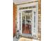 A welcoming foyer with views of the home's interior through the front door at 7090 Blue Sky Drive, Locust Grove, GA 30248