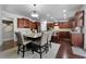 Well-appointed kitchen featuring hardwood floors, a large island, and stainless steel appliances at 7090 Blue Sky Drive, Locust Grove, GA 30248