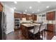 Stylish kitchen with wood cabinets, hardwood floors, and granite countertops at 7090 Blue Sky Drive, Locust Grove, GA 30248