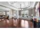 Elegant living room featuring coffered ceilings, hardwood floors, and large windows at 7090 Blue Sky Drive, Locust Grove, GA 30248