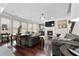 Spacious living room boasting a fireplace, hardwood floors, and ample seating at 7090 Blue Sky Drive, Locust Grove, GA 30248