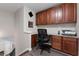 Upper-level office area featuring built-in cabinets and desk space at 7090 Blue Sky Drive, Locust Grove, GA 30248