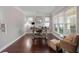 Bright home office with natural light, neutral walls, and a traditional-style desk at 7090 Blue Sky Drive, Locust Grove, GA 30248
