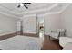 Large sitting area with hardwood floors, an area rug and coffered ceiling at 7090 Blue Sky Drive, Locust Grove, GA 30248