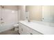 Bathroom with combination shower and bathtub, and white vanity and counter at 8245 Dawson View Way, Cumming, GA 30028
