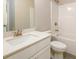 Bathroom with modern sink, white cabinets, and a shower-tub combination at 8245 Dawson View Way, Cumming, GA 30028