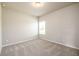 Bedroom with neutral walls, carpeting, and a natural light window at 8245 Dawson View Way, Cumming, GA 30028