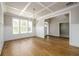 Bright dining room with hardwood floors, large windows, and stylish wainscoting at 8245 Dawson View Way, Cumming, GA 30028