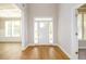 Bright and spacious foyer with hardwood floors and natural light at 8245 Dawson View Way, Cumming, GA 30028