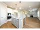Bright kitchen featuring a center island, stainless appliances, and an open floor plan at 8245 Dawson View Way, Cumming, GA 30028