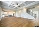Spacious open-concept living room with beautiful floors, flowing seamlessly into the kitchen area at 8245 Dawson View Way, Cumming, GA 30028