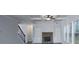 Bright living room featuring coffered ceilings, stone fireplace, and lots of natural light at 8245 Dawson View Way, Cumming, GA 30028