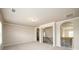 Upstairs landing featuring neutral walls, carpet and wood and iron railings at 8245 Dawson View Way, Cumming, GA 30028