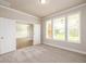 Well-lit office space with plush carpet and double doors at 8245 Dawson View Way, Cumming, GA 30028