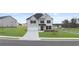 Charming two-story home with a manicured lawn and a two-car garage at 1099 Blue Juniper Cir, Loganville, GA 30052