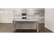 Elegant kitchen with a large center island and modern finishes at 1099 Blue Juniper Cir, Loganville, GA 30052