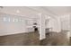 Open living space showing an eat-in kitchen, stainless appliances, and a kitchen island at 1099 Blue Juniper Cir, Loganville, GA 30052