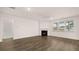Spacious living room with fireplace, ceiling fan and abundant natural light at 1099 Blue Juniper Cir, Loganville, GA 30052