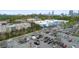 Aerial view of a parking lot and shopping center, with cityscape under the blue sky at 1115 Martin Luther King Jr Sw Dr, Atlanta, GA 30314