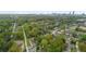 This is an aerial view of a commercial property, the Atlanta skyline, and surrounding greenery at 1115 Martin Luther King Jr Sw Dr, Atlanta, GA 30314