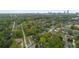 This is an aerial view of a commercial property, the Atlanta skyline, and surrounding greenery at 1115 Martin Luther King Jr Sw Dr, Atlanta, GA 30314