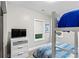 Bedroom features a bunk bed with a view out of two windows and a TV at 1115 Martin Luther King Jr Sw Dr, Atlanta, GA 30314