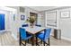 Cozy dining room featuring a marble table, four upholstered chairs, and stylish decor at 1115 Martin Luther King Jr Sw Dr, Atlanta, GA 30314