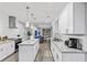 Modern kitchen with white cabinets, granite countertops, stainless steel appliances, and a center island for food prep at 1115 Martin Luther King Jr Sw Dr, Atlanta, GA 30314