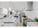 Open-concept kitchen featuring stainless appliances, granite countertops, and seamless flow to the living area at 1115 Martin Luther King Jr Sw Dr, Atlanta, GA 30314