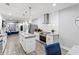 Modern kitchen boasts stainless appliances, granite countertops, and an island with pendant lighting at 1115 Martin Luther King Jr Sw Dr, Atlanta, GA 30314