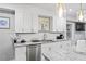 Bright kitchen with stainless steel appliances, granite countertops, and ample cabinet space at 1115 Martin Luther King Jr Sw Dr, Atlanta, GA 30314