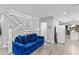 Inviting living room with a comfortable sofa, open staircase, and bright, neutral decor at 1115 Martin Luther King Jr Sw Dr, Atlanta, GA 30314