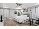 Bright main bedroom boasts a ceiling fan, recessed lighting, and sleek flooring at 1115 Martin Luther King Jr Sw Dr, Atlanta, GA 30314
