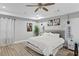 Spacious main bedroom featuring a ceiling fan, recessed lighting, and an appealing grey color palette at 1115 Martin Luther King Jr Sw Dr, Atlanta, GA 30314
