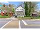 Street view showcasing a two-story home with a welcoming front porch and manicured lawn in a neighborhood setting at 1115 Martin Luther King Jr Sw Dr, Atlanta, GA 30314