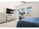Well-lit bedroom with neutral decor, workstation area, and large windows providing natural light at 3905 Danube Ln # 215, Atlanta, GA 30339
