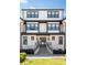 Elegant brick home entrance with stairs leading to a stylish front door at 3905 Danube Ln # 215, Atlanta, GA 30339