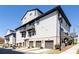 Modern townhome showcasing attractive architecture, individual garages, and well-maintained landscaping at 3905 Danube Ln # 215, Atlanta, GA 30339