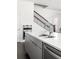 Modern kitchen island featuring stainless steel sink, dishwasher, and undermount cabinet at 3905 Danube Ln # 215, Atlanta, GA 30339