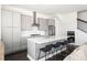 Modern kitchen with white countertops, stainless steel appliances, and stylish barstool seating at 3905 Danube Ln # 215, Atlanta, GA 30339