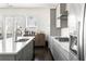 Bright kitchen featuring stainless steel appliances, white counters, and modern gray cabinetry at 3905 Danube Ln # 215, Atlanta, GA 30339