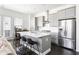 Bright kitchen with gray cabinets, stainless steel appliances, and a large center island perfect for entertaining at 3905 Danube Ln # 215, Atlanta, GA 30339