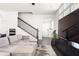 Well-lit living room featuring hardwood floors, stairs, and open floorplan design at 3905 Danube Ln # 215, Atlanta, GA 30339