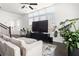 Bright living room with large windows, hardwood floors, and a large, modern television at 3905 Danube Ln # 215, Atlanta, GA 30339